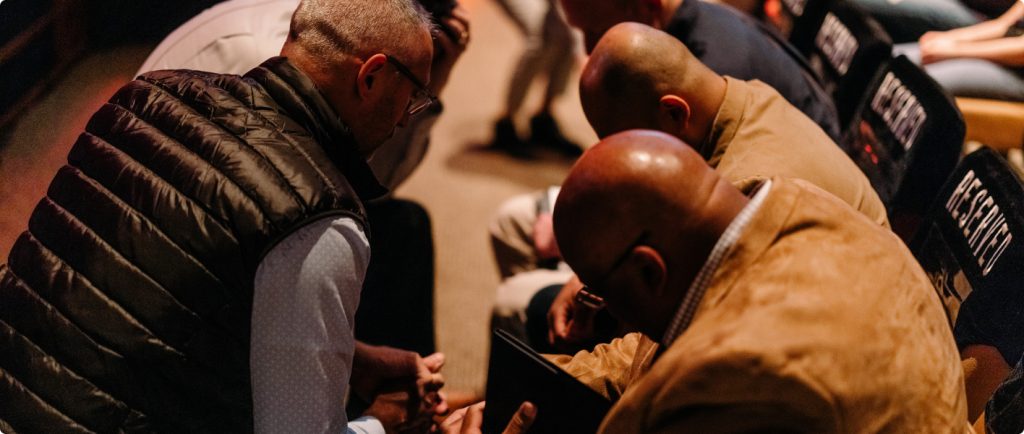 People praying together in church