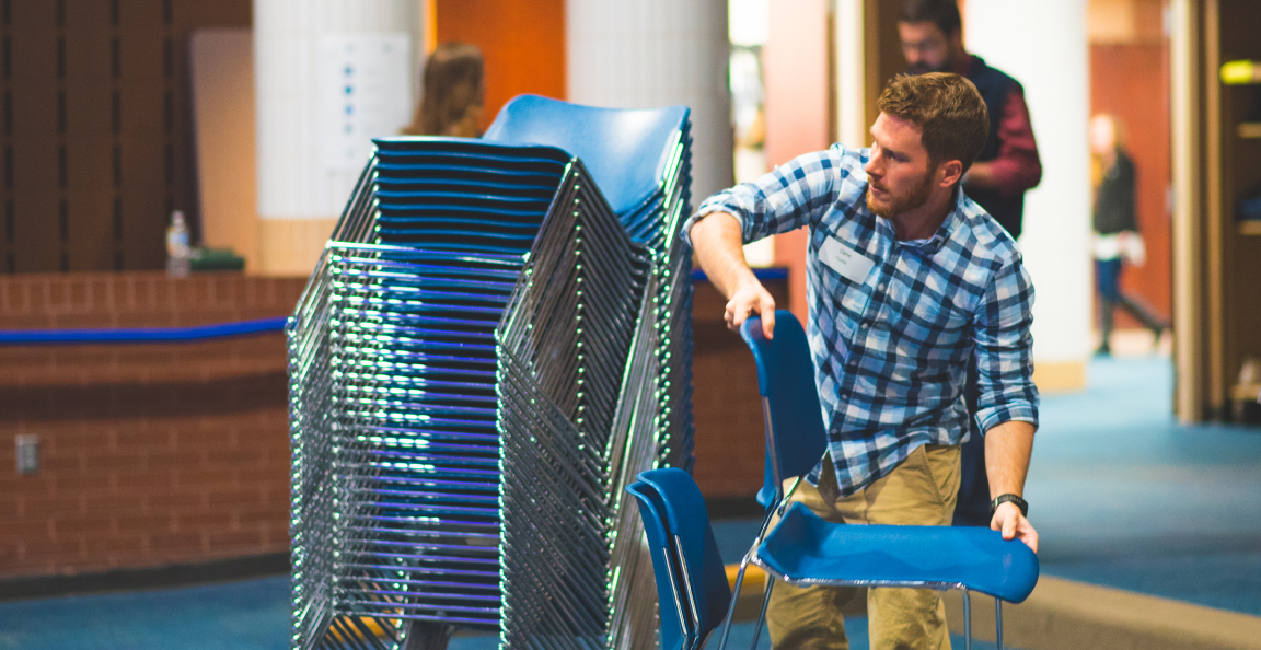 091917-CollegeParkFishers-210-1 Man stacking chairs
