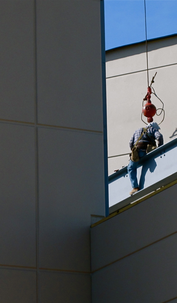 5146015543_7677448c9c_o Construction worker on a beam